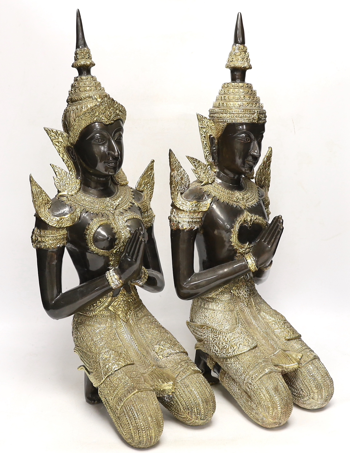 Two 20th century gilt decorated metal models of 'Thai Buddhas', 54 cm high